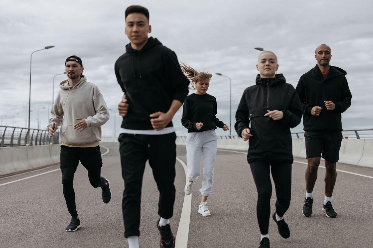 Mastering the First Impression: Your intriguing post title goes here A diverse group of adults jogging together outdoors on a cloudy day.